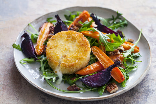 Ensalada de arúgula con queso de cabra tibio y verduras asadas
